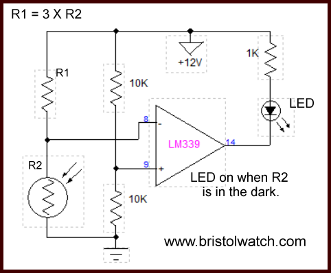 Photocell comparator circuit turns on in dark.